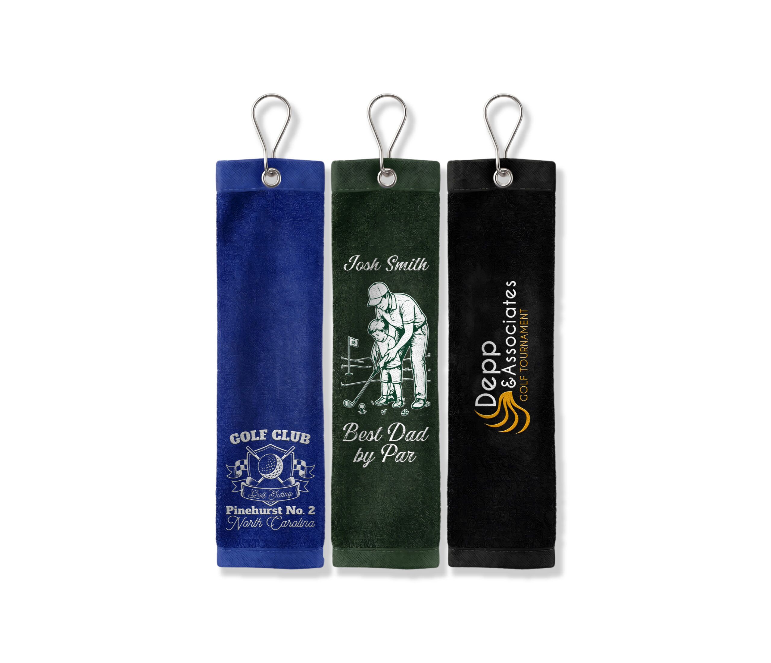 Three custom CoolieNation golf towels with grommets and clips: a blue Pinehurst Golf Club towel, a green Best Dad by Par towel, and a black Depp & Associates tournament towel.