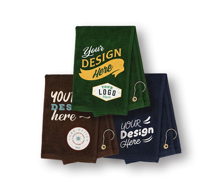 Three personalized golf towels with unique designs and logos
