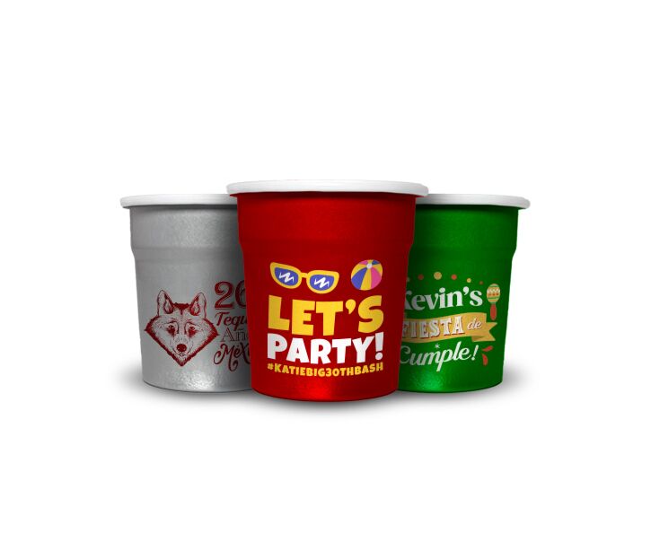 Three personalized aluminum shot glasses with tequila branding and birthday graphics on 1.5oz reusable metal cups